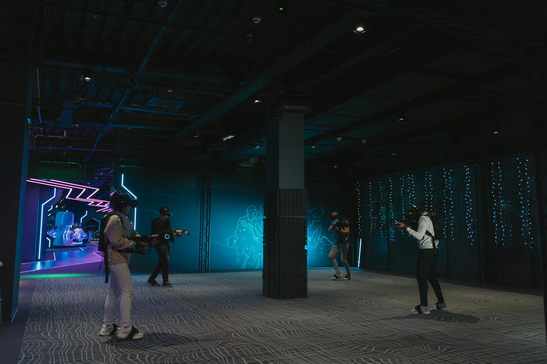Group of young adults engaging in a futuristic virtual reality game indoors.